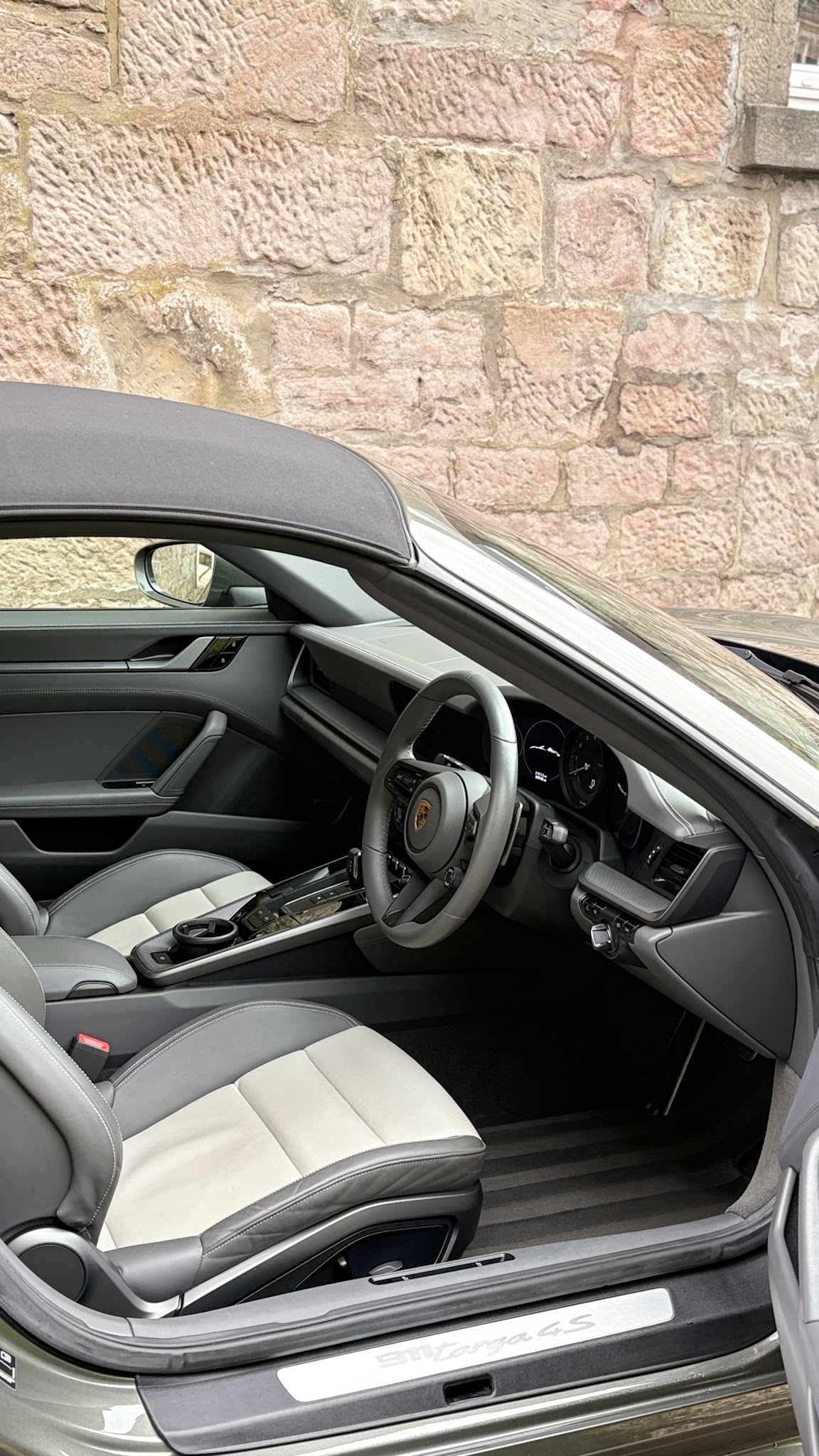 The deep-cleaned two-tone leather interior of a Porsche convertible